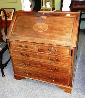 Lot 597 - An Edwardian Mahogany Satinwood Banded and Ebony Strung Bureau, the fall inlaid with oval...