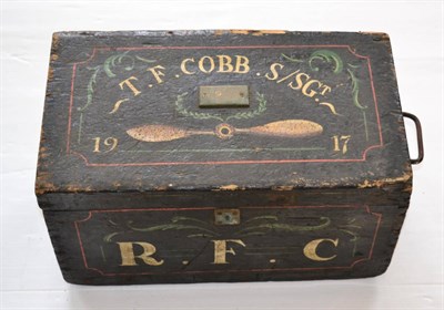 Lot 167 - A First World War Royal Flying Corps Pine Box, the hinged cover painted with two propeller...