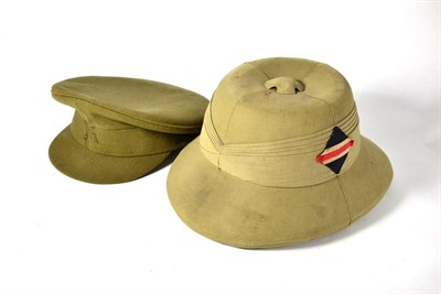 Lot 215 - A Second World War Pith Helmet, by the Peninsular Hat Mfg. Co., Calcutta, dated 1939, with five...