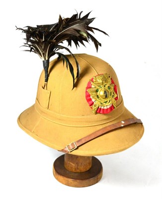 Lot 217 - A Second World War Italian 1st Bersaglieri Tropical Helmet, in ribbed tan canvas, with gilt...