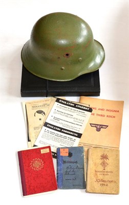 Lot 238 - A First World War German Army Helmet Shell, finished in green paint; a Collection of German...