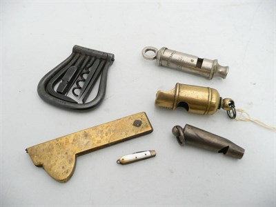 Lot 617 - A Fleam; A Well's Steel Pocket Tool Compendium; and Three Whistles (5)