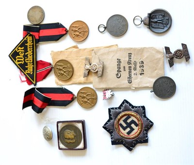 Lot 260 - A German Third Reich Cross in Gold, cloth version, with paper backing; a Small Collection of Medals