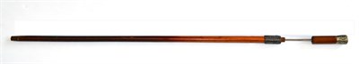 Lot 307 - A 19th Malacca Swordstick, the 65cm single edge fullered steel blade faintly etched with...