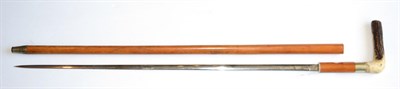 Lot 324 - An Edwardian Malacca Swordstick, with 70.5cm double edge steel blade, nickel collar and antler...