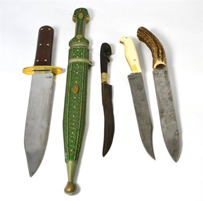 Lot 330 - An Eastern Kindjal, with double edge fullered steel blade, the green painted nickel hilt and...