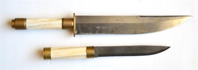 Lot 331 - A Bowie Knife, with single edge clip-point steel blade and twisted  bleached horn grip; a Very...