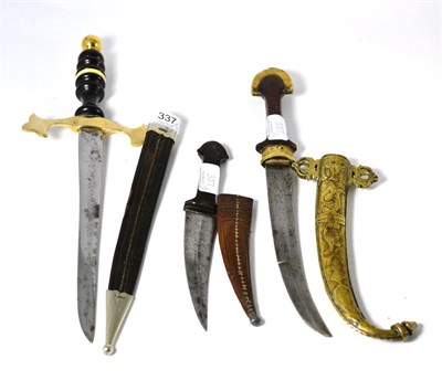 Lot 337 - An Ornamental Dagger, with 26cm single edge fullered steel blade, brass crossguard and baluster...