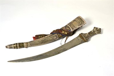 Lot 364 - A 19th Century Arab Wahabite Jambiya, with 36cm double edge curved steel blade, the silver...