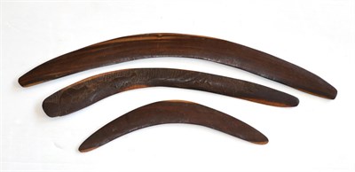 Lot 376 - Three Australian Aborigine Fighting Sticks (Boomerangs), one with one side carved with kangaroo...