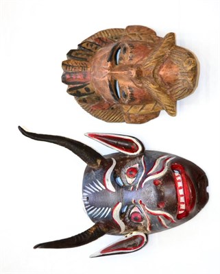 Lot 396 - A Mexican Polychrome Wood Devil Mask, of oval form, with real antelope horns, the grimacing...