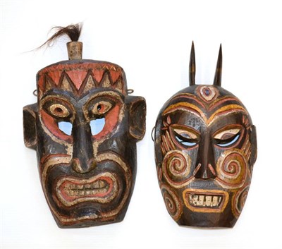 Lot 397 - Two South China Polychrome Wood Masks, each with pierced eyes, aquiline nose and grimacing...