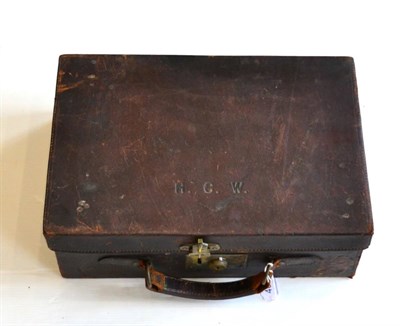 Lot 405 - A Stitched Leather Cartridge Case, the hinged cover embossed H.C.W., with brass lock and rolled...