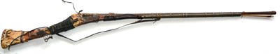 Lot 511 - A 19th Century Indian Matchlock Long Gun, the 120.5cm three stage steel barrel fluted at the...