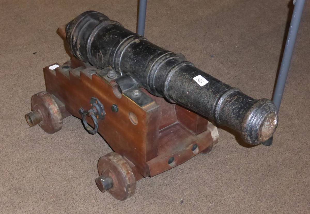 Lot 526 - A Late 18th Century Black Painted Cast Iron Small Naval Cannon, three and a half pound, the...