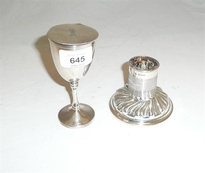 Lot 645 - A Victorian Silver Candle Holder, London 1887; and A 19th Century Travelling Communion Goblet (2)