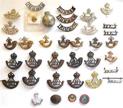 Lot 58 - A Small Collection of Cap and Collar Badges to the Durham Light Infantry, in bronze, brass and...