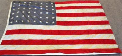 Lot 70 - An Early/Mid 20th Century American Flag, of thirteen red and white cotton panels and the main...