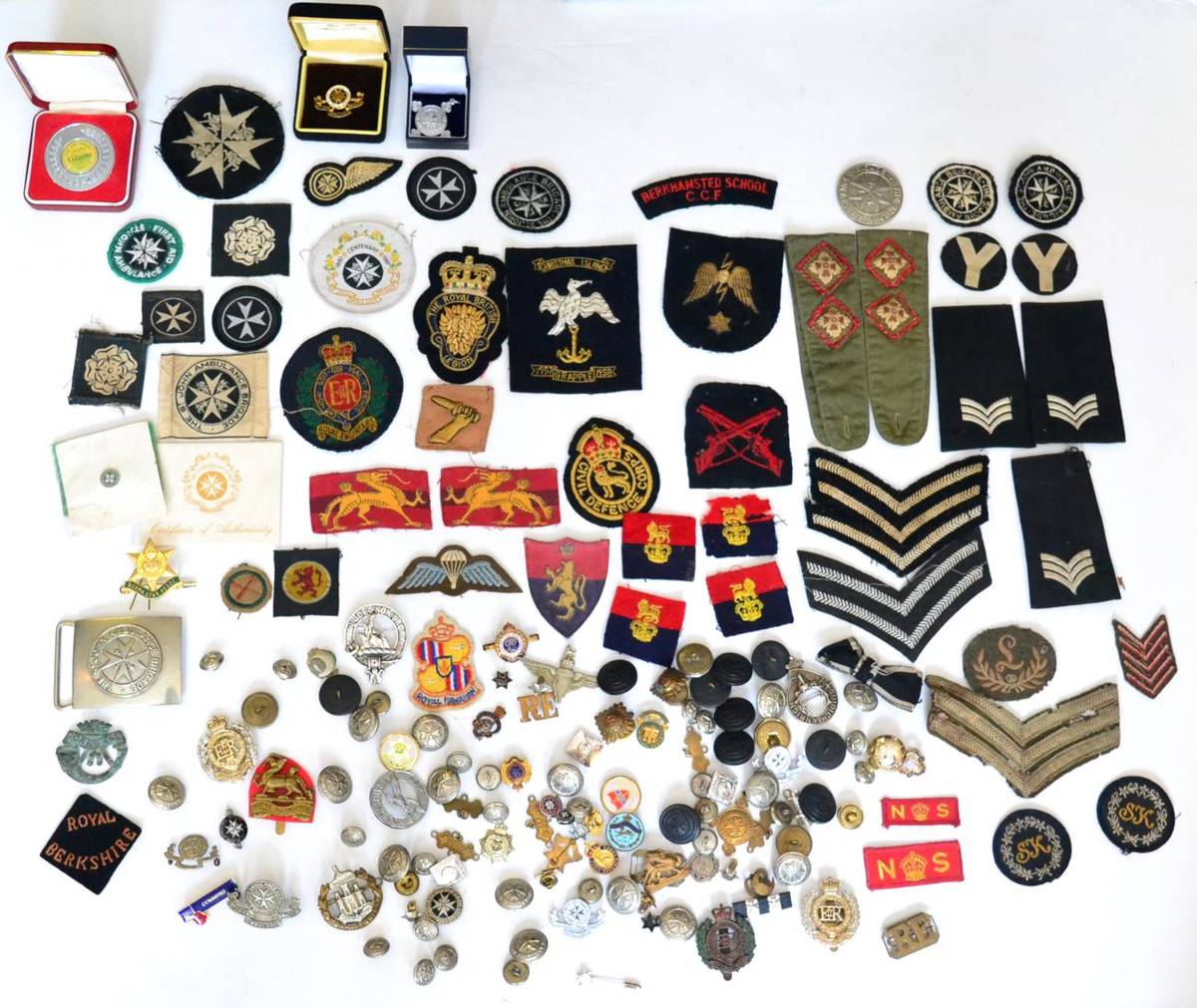 Lot 87 - A Collection of Militaria, including military and St John Ambulance Brigade cap badges, buttons and