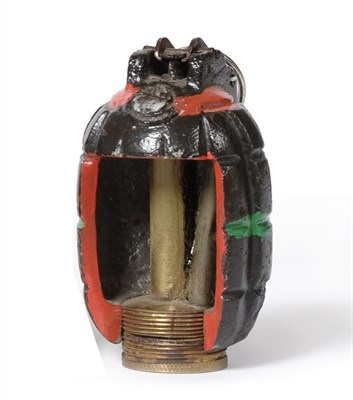 Lot 119 - A First World War No.5 Mk.1 Mills Bomb (Hand Grenade), the base dated 1916, the side cut-away...