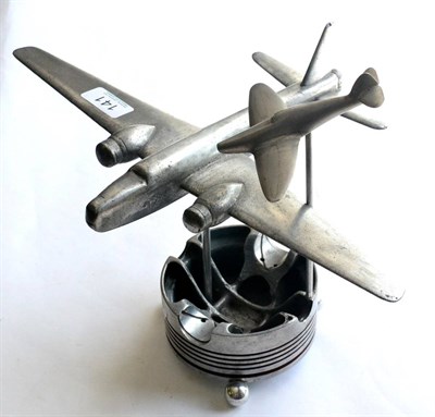 Lot 141 - A Second World War Aircraft Piston Head Desk Ornament, surmounted by the models of a Spitfire and a