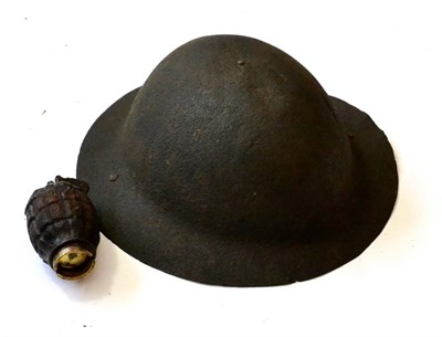 Lot 147 - A First World War British Brodie Helmet, in relic condition; a First World War No.5 Mk.I Hand...