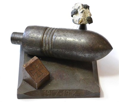 Lot 149 - A First World War German Shell, mounted as a desk ornament, with a piece of concrete from a...