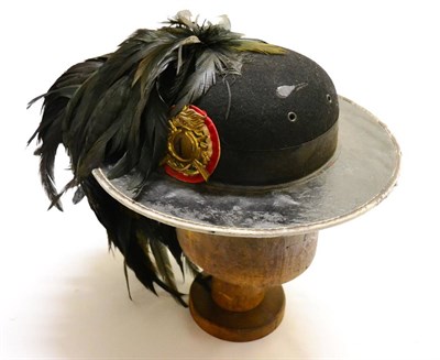 Lot 203 - A Second World War Italian 1st Bersaglieri Dress Cap, of pressed black felt, the oil cloth brim...