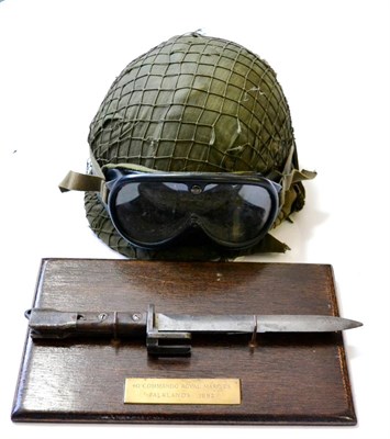 Lot 207 - A Falklands War Argentinian Combat Helmet, with webbing and leather liner named Scheltinger,...