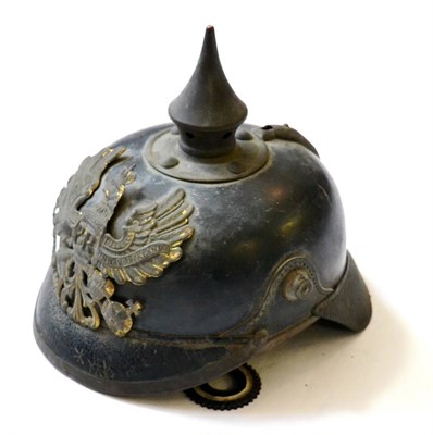 Lot 211 - A Prussian Enlisted Black Leather Pickelhaube, with pressed brass helmet plate, brass spike...