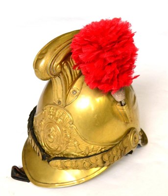 Lot 214 - A French Brass Fire Helmet to the Town of Crecy, with fluted comb, the left side of the skull...