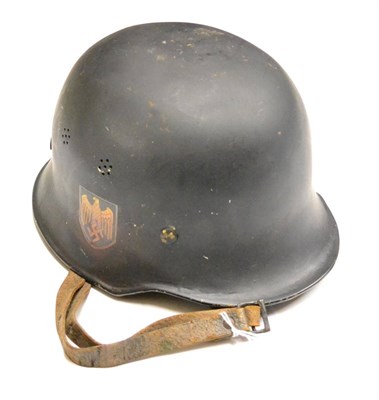 Lot 247 - A German Third Reich Style Police Helmet, with black painted finish, later double decals,...