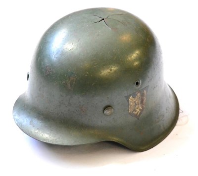 Lot 252 - A German Third Reich M42 Army Helmet, with apple green paint and army eagle decal with a...