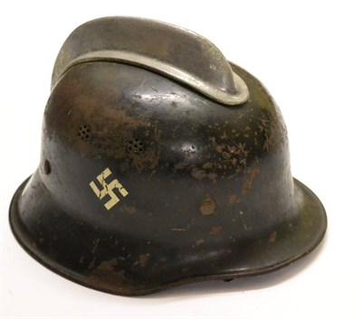 Lot 253 - A German Third Reich M35 Fireman's Helmet, double decals of swastika and national shield, with...