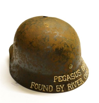 Lot 262 - A German Third Reich M40 Army Helmet Shell, the left side of the inner brim stamped ET64, with...