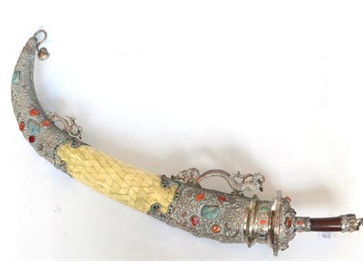 Lot 276 - A 20th Century Tibetan Ceremonial Khanjar Type Sword, the 31cm single edge curved steel blade...