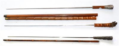 Lot 290 - An Indonesian Bamboo Sword Stick, with 69cm plain square tapering steel blade, the silver...