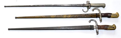 Lot 302 - Two French Model 1874 ";Gras"; Sword Bayonets, one with blade back edge engraved Mre d' Armes...