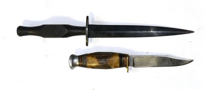 Lot 340 - A Second World War Naval Fighting Knife, with blued diamond section steel blade, the top of the...