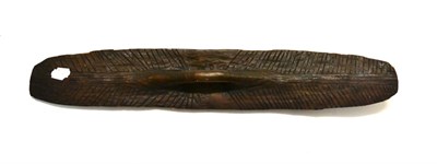 Lot 373 - An Australian Aborigine Parrying Shield, each side with incised decoration, with integral...