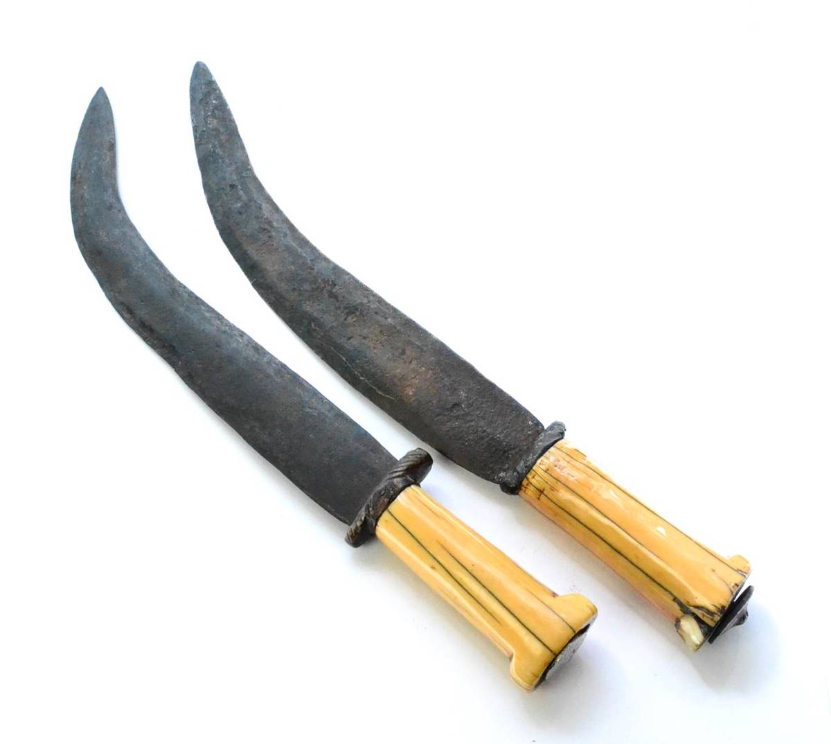 Lot 379 - Two Dinka Knives, Sudan, each with 28cm double edge curved steel blade and cylindrical ivory...