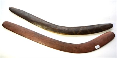 Lot 385 - Two 20th Century Australian Aborigine Boomerangs, one carved with a chevron band of triple grooves