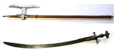 Lot 394 - An 18th Century Indian Talwar, with 72cm draw back steel blade, iron hilt with long langets,...