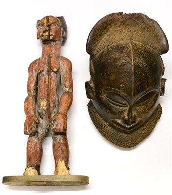 Lot 406 - A Large African Palmwood Helmet Mask, possibly Cameroon, with diaper carved headdress and...