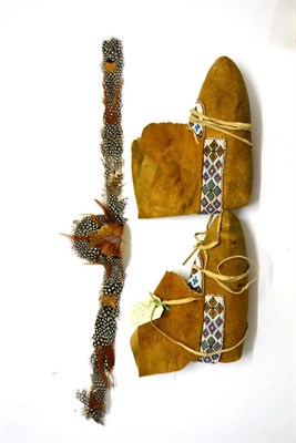 Lot 408 - A Pair of Native American Buckskin Moccasins, applied with bands of coloured glass beadwork...