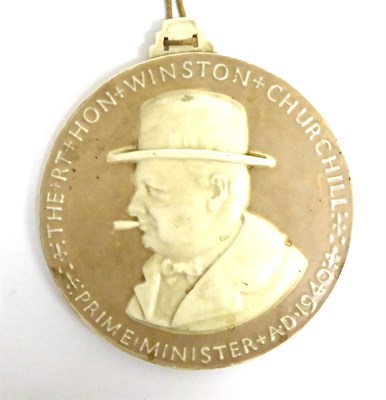 Lot 144 - A Poole Pottery Plaque The Rt Hon. Winston Churchill, Prime Minister A.D. 1940, of circular...