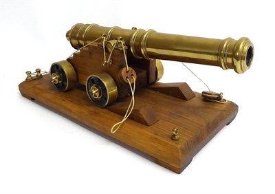 Lot 167 - A Good Quality Brass Model of a Signal Cannon, the 32cm five ringed brass barrel with swollen...