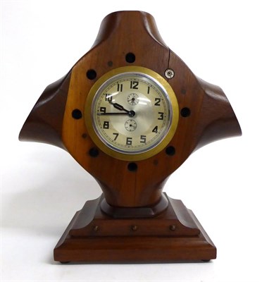 Lot 197 - A Laminated Mahogany Aeroplane Propeller Hub Alarum Mantel Clock, the circular silvered dial...