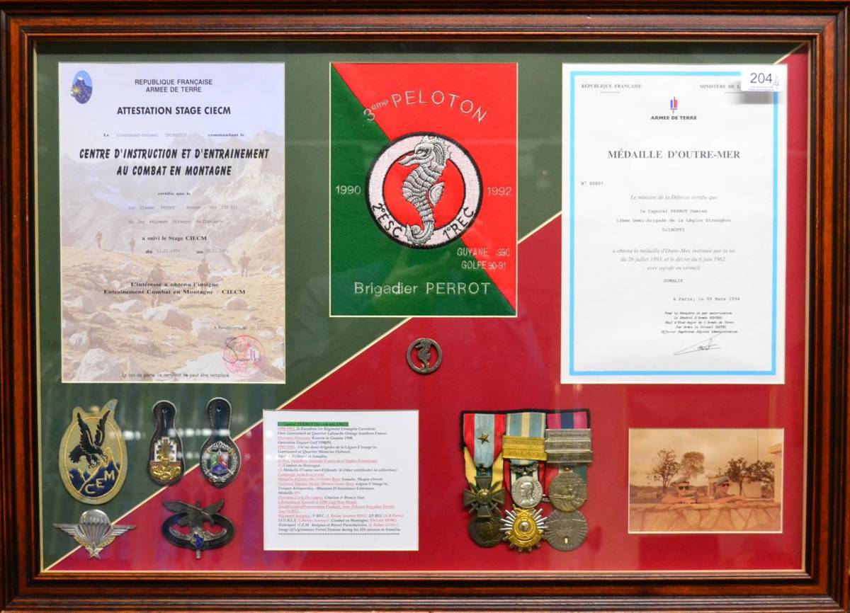 Lot 204 - French Foreign Legion, a framed display including medals, cloth and metal badges and photograph, to