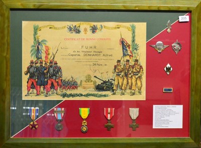 Lot 205 - French Foreign Legion, a framed display comprising certificate, medals and metal badges, to Caporal